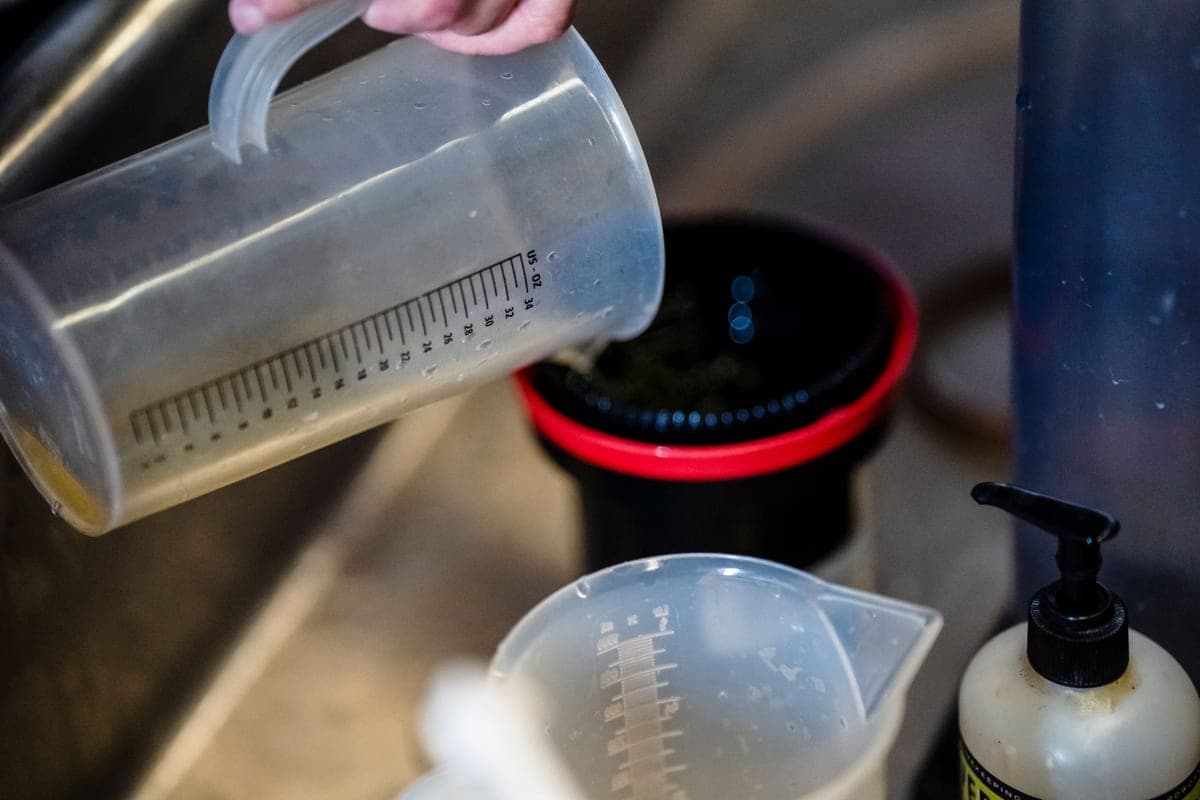Illustrative stock photo: a clear measuring cup being used in a kitchen