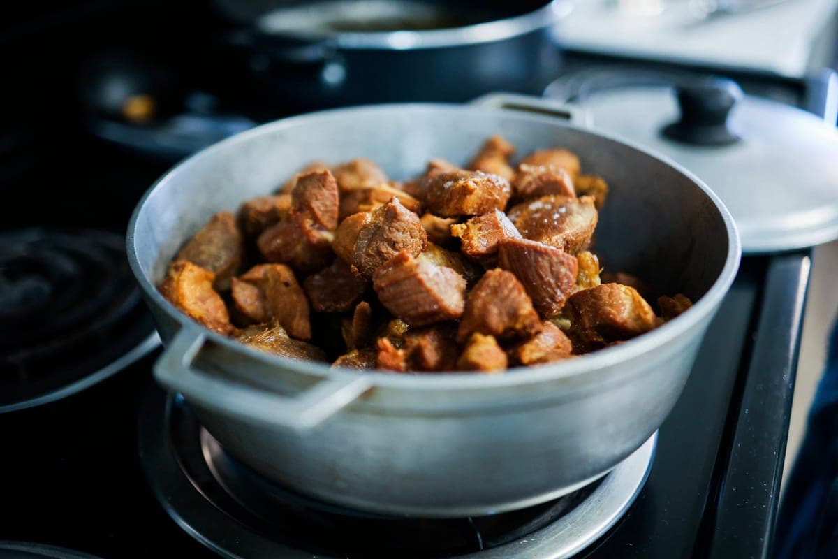Illustrative stock photo: pieces of cooked meat in a large pot